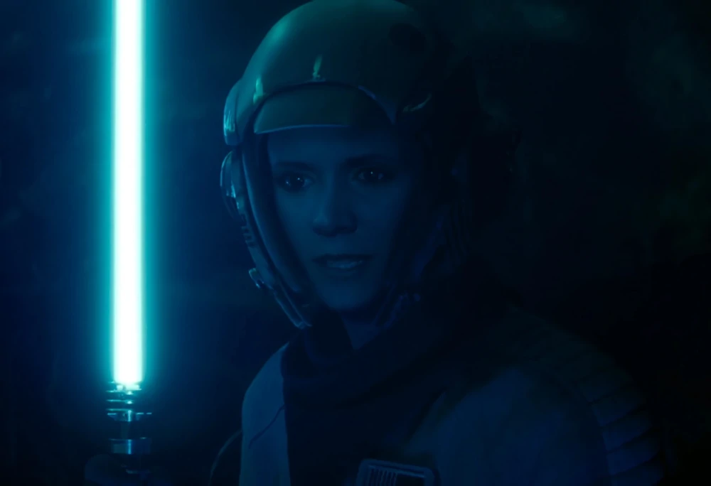 Princess Leia with her blue-bladed lightsaber